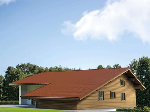 Modern huis met koperbruin pannen dak, genesteld in een groen landschap en heldere hemel
