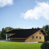 Dakpanplaat 2/1060 zwart op het dak van een houten huis, toepassingsvoorbeeld