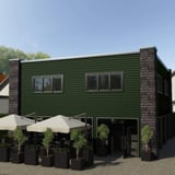 Damwandplaat 20/1100 wand chroomoxide groen als gevelbekleding van een gebouw met ramen en deur