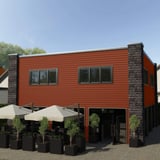 Gebouw met wandbekleding van Koperbruin damwandplaat 20/1100, toepassingsvoorbeeld