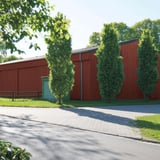 Bedrijfsgebouw met wandbekleding van damwandplaat 35/207 aluminium 0,70 mm roodbruin