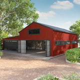 Gebouw met wandbekleding van Koraalrode damwandplaat T20M RAL 3016 als toepassingsvoorbeeld