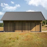 Damwandplaat T45/333M, grijs aluminiumkleurig, als dakbedekking op een houten schuur