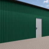 Mosgroene damwandplaat T7M als wandbekleding op een gebouw met deur