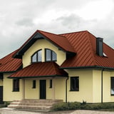 Staande felsplaat PD-510-S trapezium Terracotta op een dak met dakkapellen en luifel