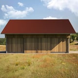 Golfplaat 18/1064 aluminium 0,70 mm roodbruin als dakbedekking op een houten schuur