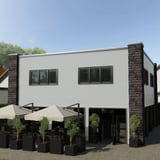 Golfplaat 18/1064, lichtgrijs, als wandbekleding op een modern gebouw met terras