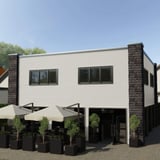 Golfplaat 18/1064 wand, Grijswit (RAL 9002), als gevelbekleding op een gebouw