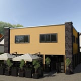 Gebouw met golfplaat PF25W Zandgeel als wandbekleding