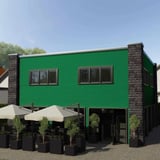Gevelbekleding van mintgroene golfplaat PF25W op een gebouw met ramen en terras