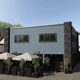 Gebouw met wandbekleding van golfplaat PF25W Pelsgrijs