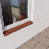 Vensterbank koperbruin RAL 8004 gemonteerd aan wit raam van een huismuur