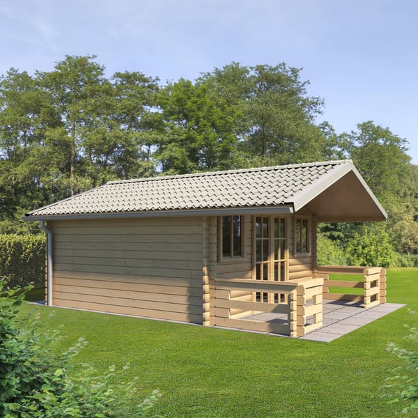 Dakpanplaat Grijswit op het dak van een klein houten huisje met veranda in de tuin