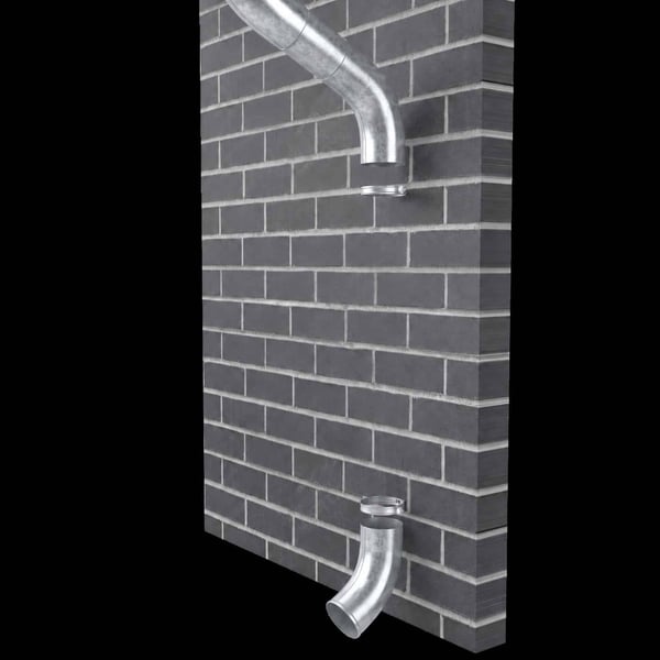 Twee verzinkte stalen regenpijpbochten gemonteerd op een donkere bakstenen muur
